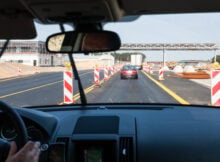 driving car along repairing area on Autostrada A2